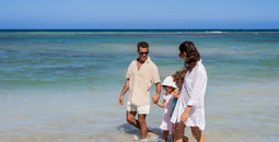 A family on the beach at Wyndham Alltra Punta Cana