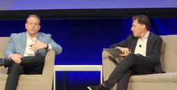 Royal Caribbean CEO Jason Liberty (left) with Arnie Weissman of Travel Weekly