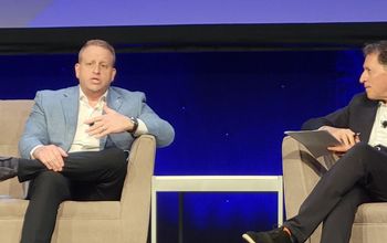 Royal Caribbean CEO Jason Liberty (left) with Arnie Weissman of Travel Weekly