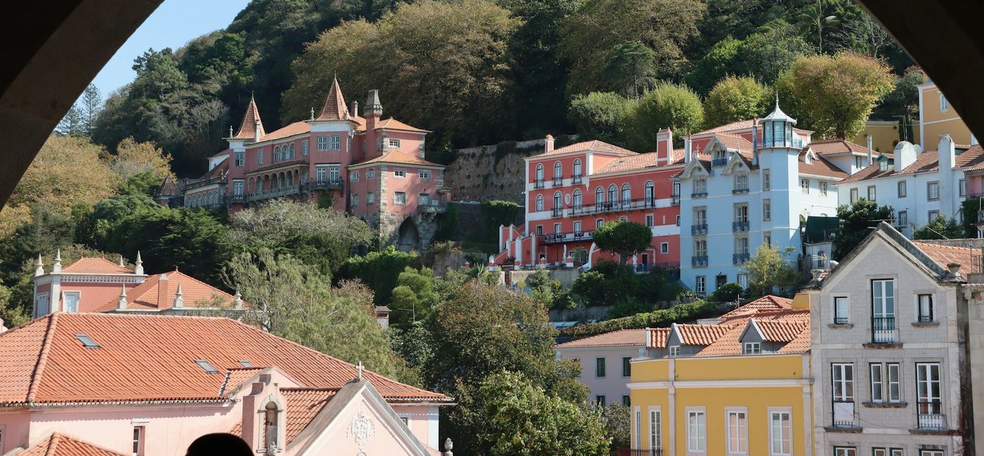 Image: A view of Sintra, Portugal through a window (Photo Credit: Hongbin on Unsplash)