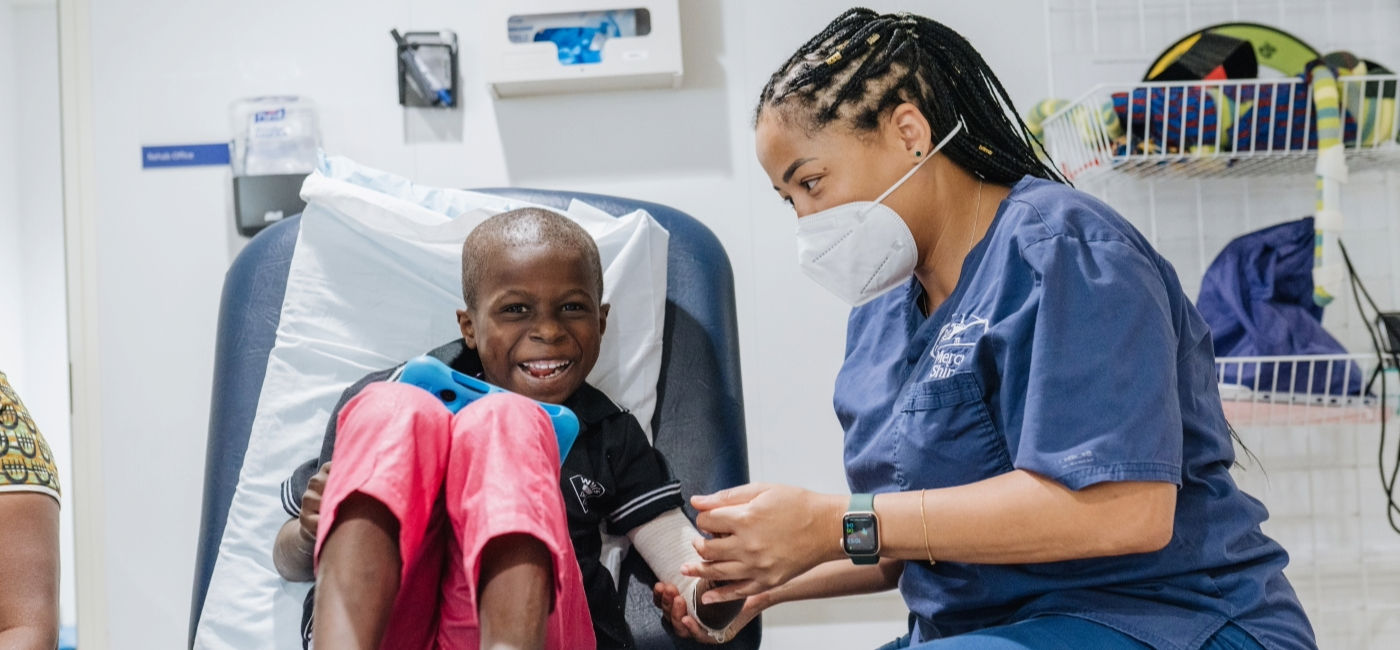Image: Yeiddy Ferreira, Hand Therapist, works with a plastics patient onboard a Mercy Ship.  (Photo Credit: Tirsa Tapia Zamora / Mercy Ships)