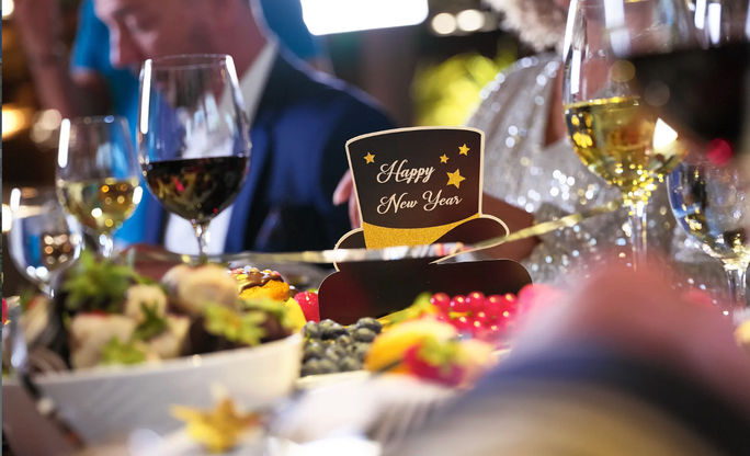 New Year's Eve celebration with food and drinks.