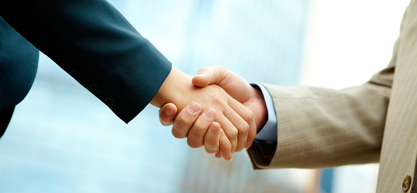 Image: PHOTO: Businessmen shaking hands. (photo courtesy of Thinkstock)