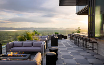 The 19-story hotel has a rooftop bar with views of the Rockies