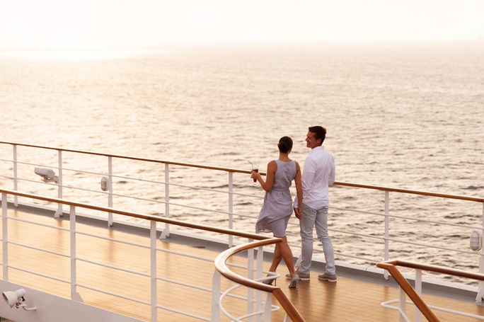Couple walking on cruise ship deck