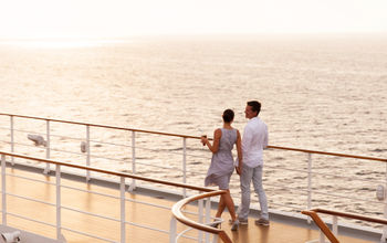 Couple walking on cruise ship deck