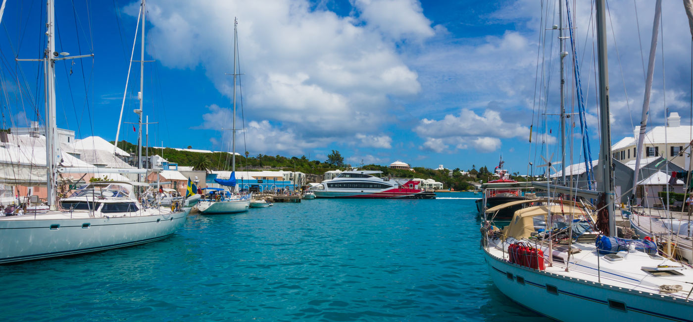 Image: Yachts and sailboats docked in St. George's Harbour, Bermuda. (Photo Credit: MaryK/Adobe Stock)