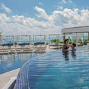Couple enjoying the pool at Sandos Cancun