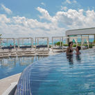 Couple enjoying the pool at Sandos Cancun