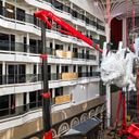The dragon sculpture being installed aboard MSC World Asia