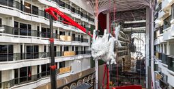 The dragon sculpture being installed aboard MSC World Asia