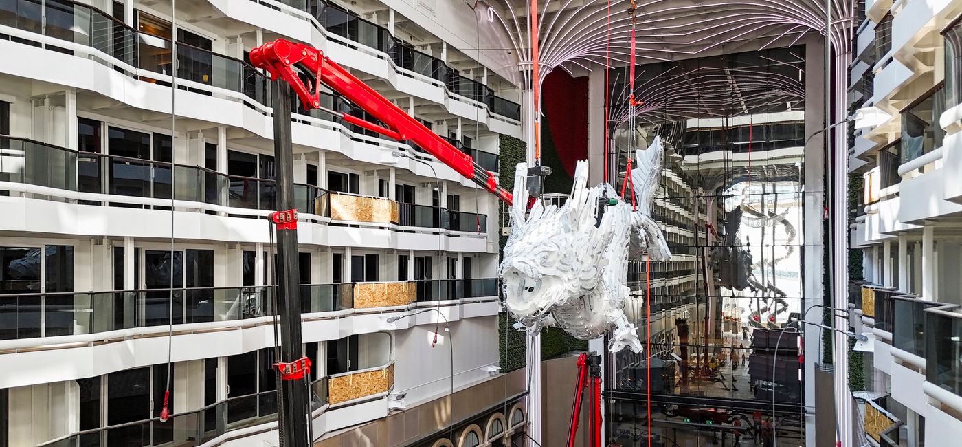 Image: The dragon sculpture being installed aboard MSC World Asia (Photo Credit: MSC Cruises)