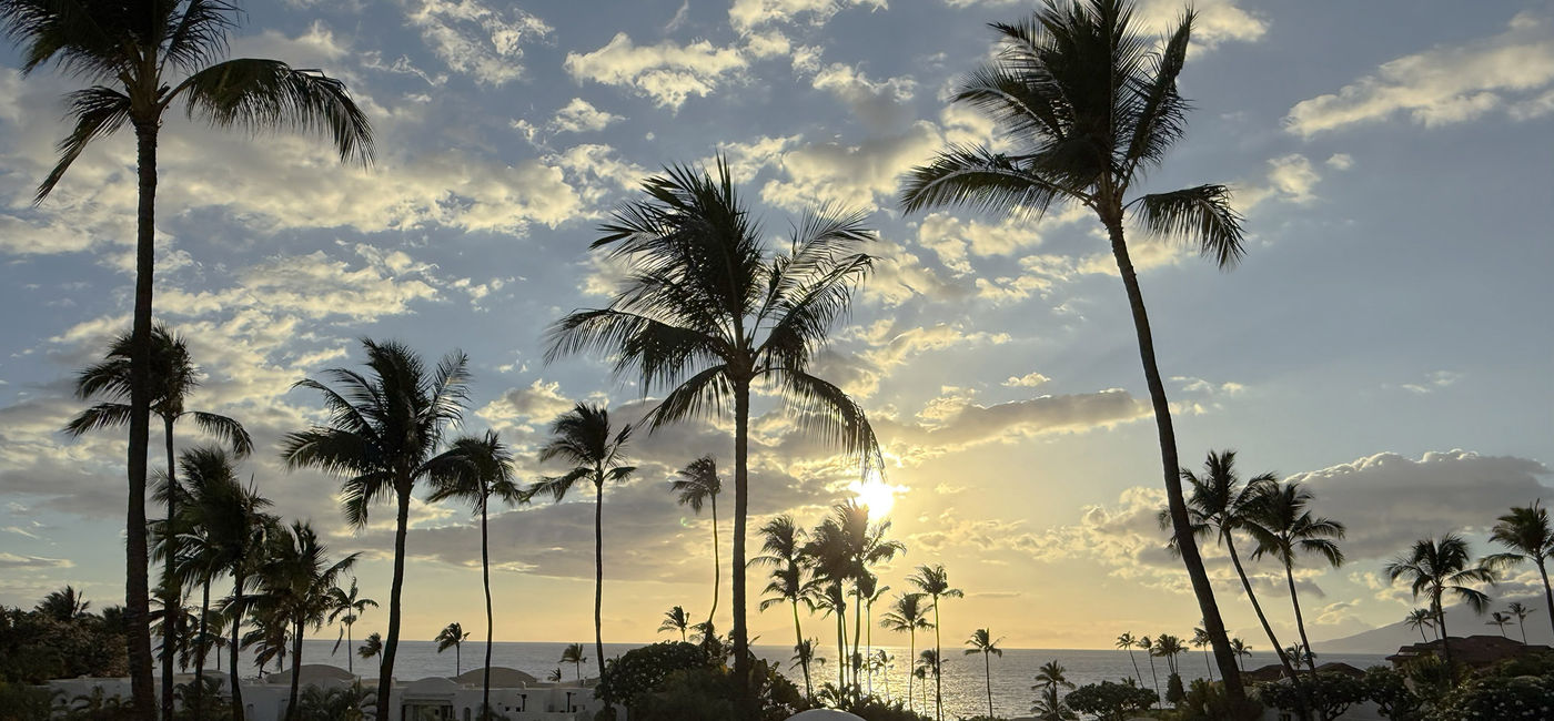 Image: Sunset from the Fairmont Kea Lani's Pilina restaurant in Wailea, Maui. (Photo Credit: Photo by Paul J. Heney.)