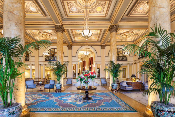 Willard Intercontinental Hotel lobby with pillars and chandelier