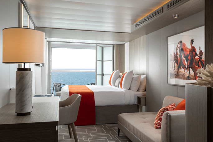 Living area inside an Infinite Veranda Stateroom aboard Celebrity Beyond.