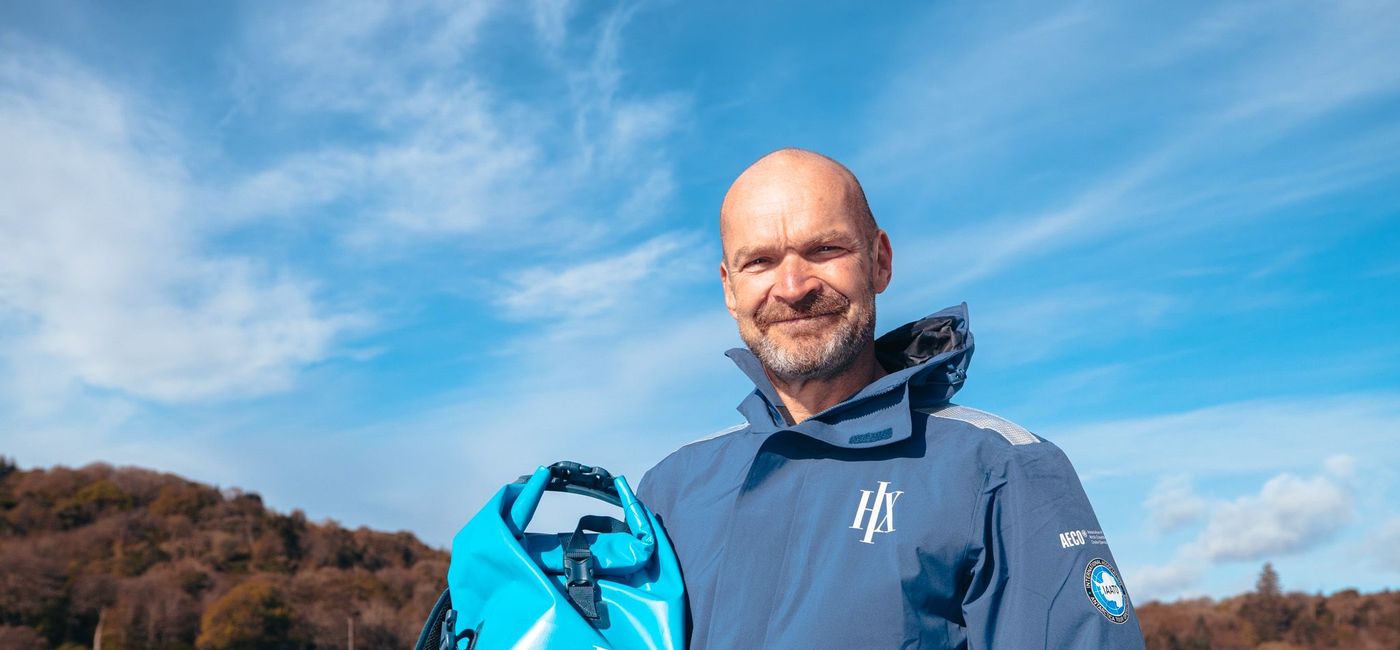 Image: Monty Halls with the Big Blue Bag (Photo Credit: HX Expeditions)