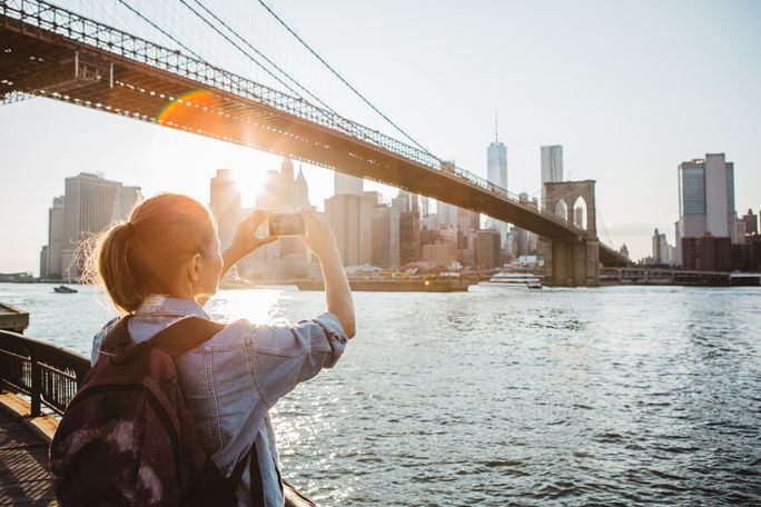 Traveler in New York City taking a picture Traveler in New York City taking a picture