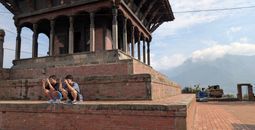two guys on a shrine in Kirtipur, Nepal
