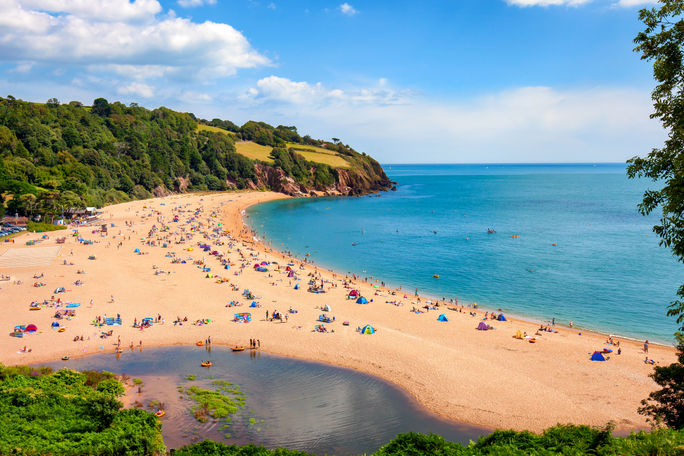 People enjoying the Blackpool Sands beach near Dartmouth in Devon, England. People enjoying the Blackpool Sands beach near Dartmouth in Devon, England.
