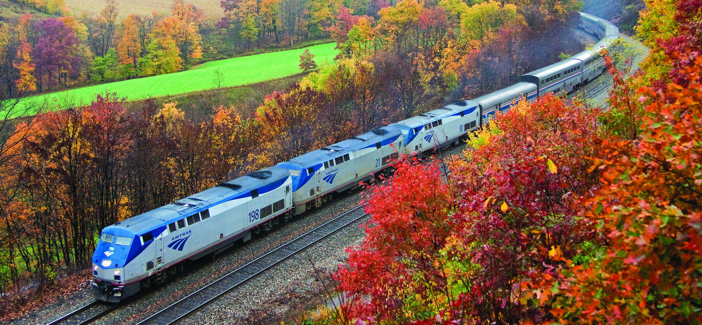 Image: Amtrak's Capitol Limited travels through the Allegheny Mountains between Pittsburgh and Cumberland during peak fall foliage season. (Photo courtesy of Amtrak) (Photo Credit: (photo via Amtrak))