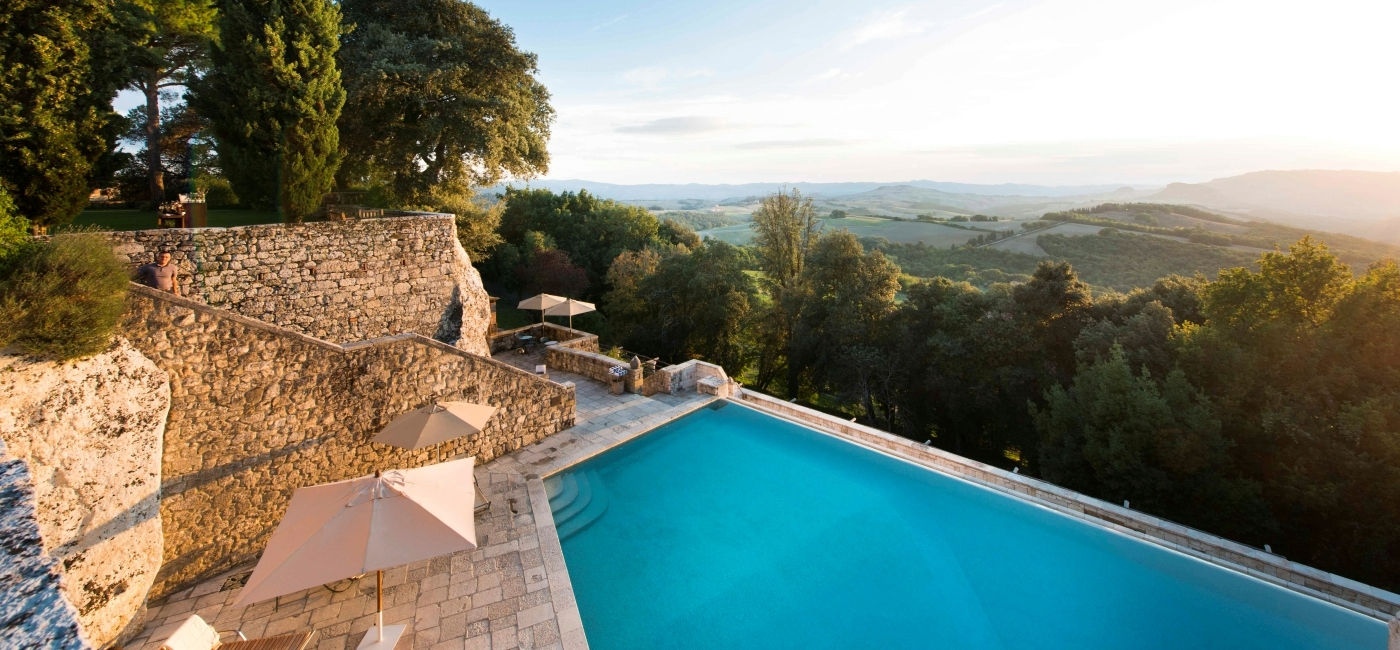 Image: Aerial view of the pool and view from Borgo Pignano, part of Beyond Green. (Photo Credit: Beyond Green)