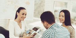 Young couple speaking to a travel advisor