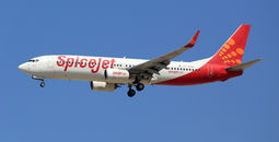 SpiceJet Boeing 737-800 airplane over Dubai Airport