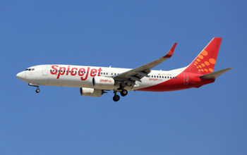 SpiceJet Boeing 737-800 airplane over Dubai Airport
