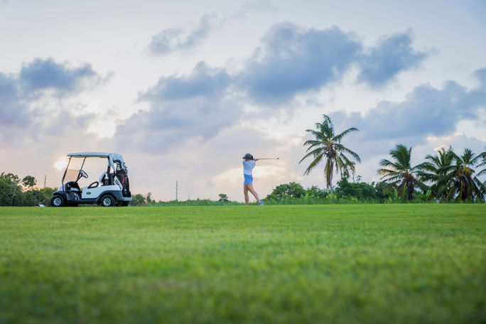 A woman playing golf 