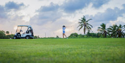 A woman playing golf