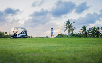 A woman playing golf