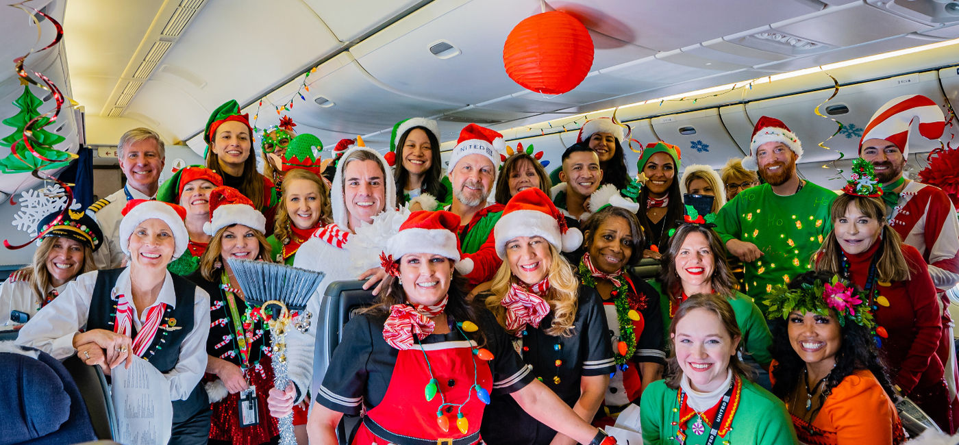 Image: United employees don Christmas attire. (Photo Credit: United Airlines)