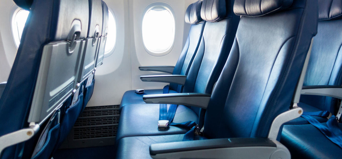Image: Rows of economy class airplane seating. (Photo Credit: Adobe Stock/tonefotografia)