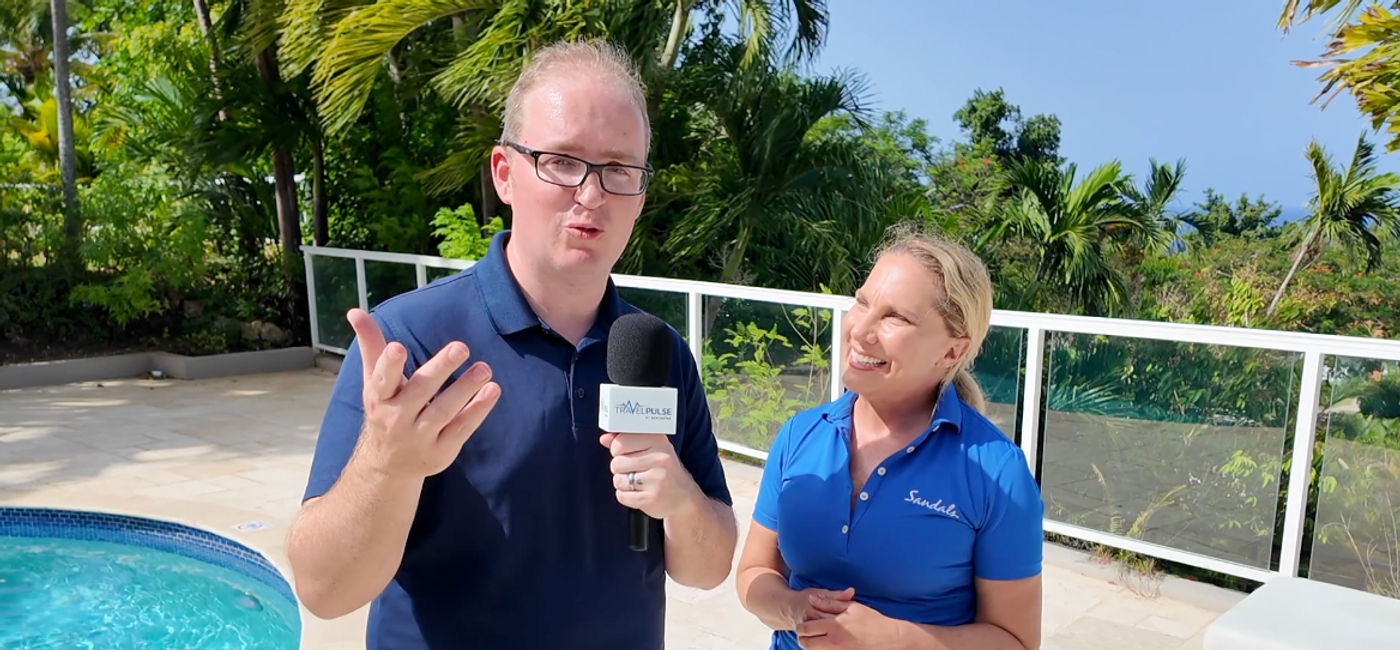 Photo: Eric Bowman interviews Dawn Bolte, Senior Director of Travel Industry Sales for Unique Vacations Inc. (Photo Credit: Eric Bowman)