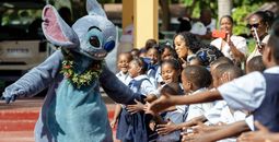 Stitch entertains children in the Bahamas as part of Disney's Holiday Magic Tour