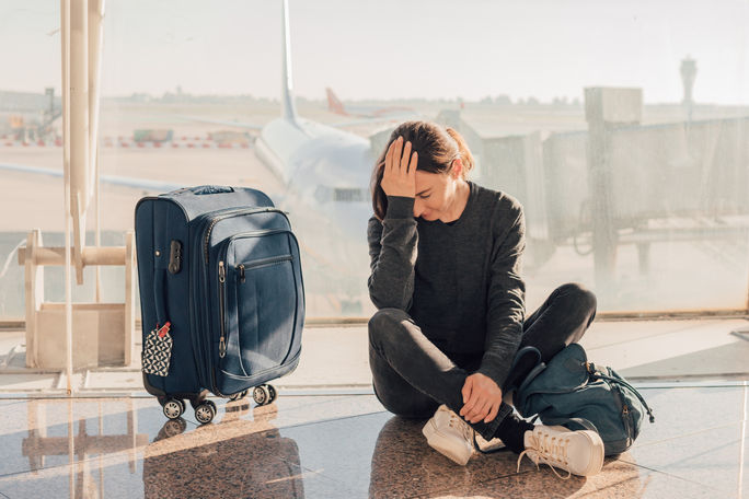 Frustrated traveler waiting for flight Frustrated traveler waiting for flight