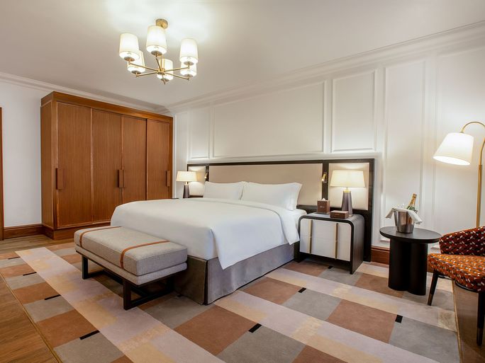 Bedroom area of a suite at Fairmont Cheshire, The Mere. Bedroom area of a suite at Fairmont Cheshire, The Mere.
