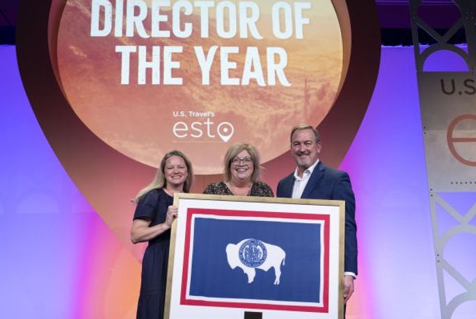 Diane Shober, executive director for the Wyoming Office of Tourism, receives the award of 2025 State Tourism Director of the Year