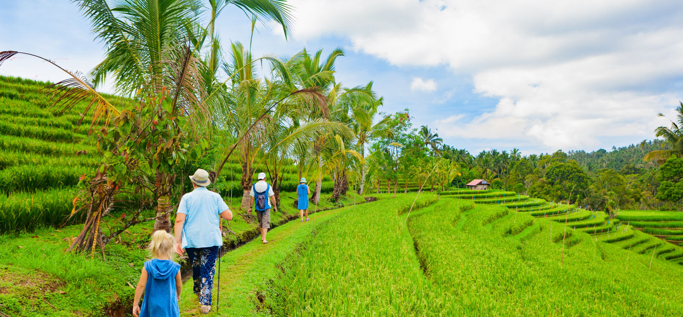 Image: Family on a nature walk in Bali, Indonesia. (Photo Credit: Tropical studio/Adobe)