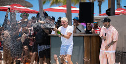 Richard Branson celebrates with champagne in Bimini, Bahamas