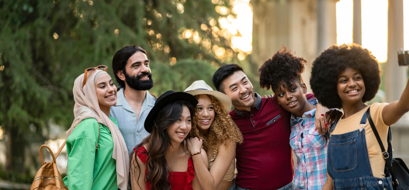 Image: A group of travelers taking a photo together.