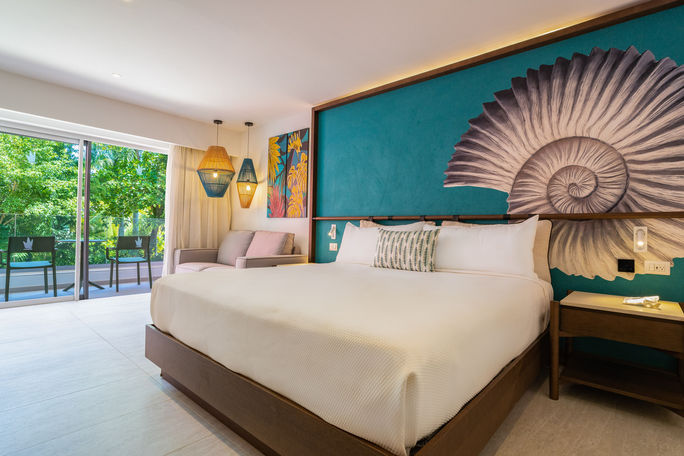 A Caribe Deluxe room with a king-sized bed at the Caribe Deluxe Princess Resort. Princess Hotels & Resorts, Caribe Deluxe Princess resort