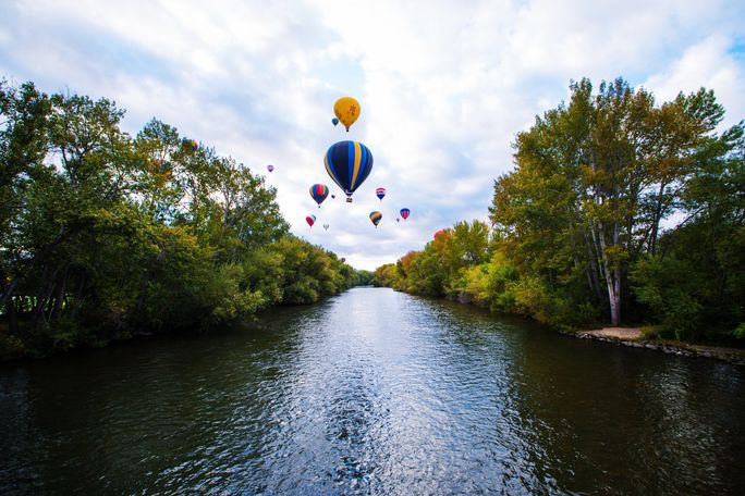 Hot air balloons over the Boise River in Boise, Idaho