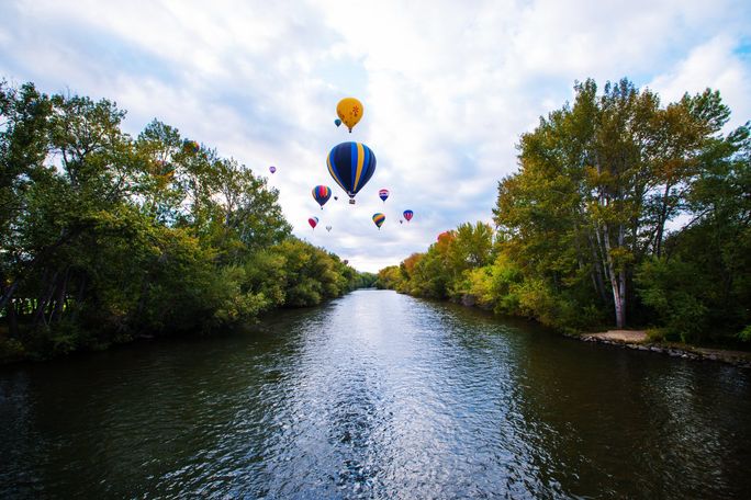 Hot air balloons over the Boise River in Boise, Idaho Hot air balloons over the Boise River in Boise, Idaho