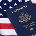 U.S. passport sitting atop an American flag.