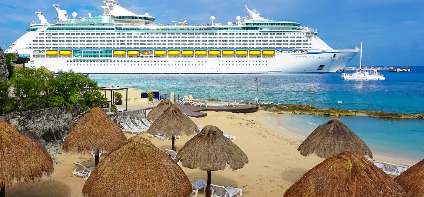 Image: Cruise ship docked in Puerta Maya, Cozumel, Mexico. (Photo Credit: Adobe Stock/Solarisys)