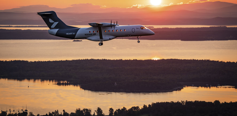 Heart Aerospace’s X1 demonstrator aircraft flies toward the rising sun above upstate New York’s Champlain Valley during its first flight