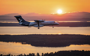 Heart Aerospace’s X1 demonstrator aircraft flies toward the rising sun above upstate New York’s Champlain Valley during its first flight