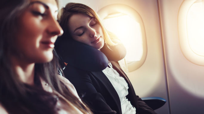 A comfy traveler in the window seat