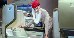 Emirates flight attendant adjusts accessible mattress